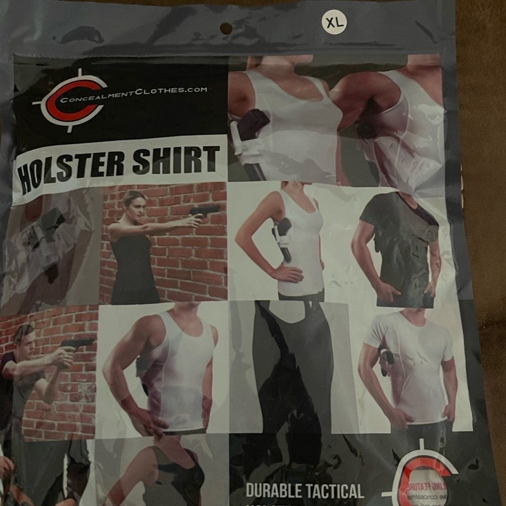 2 brand new XL Black conceal carry shirts . T shirt style.